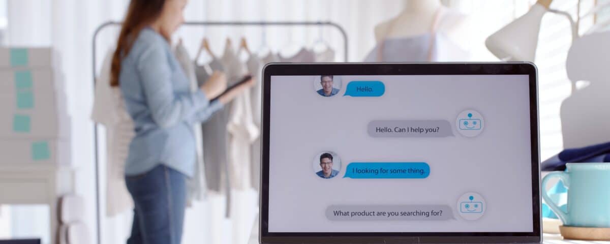 Chatbot conversation on laptop screen app interface with artificial intelligence technology