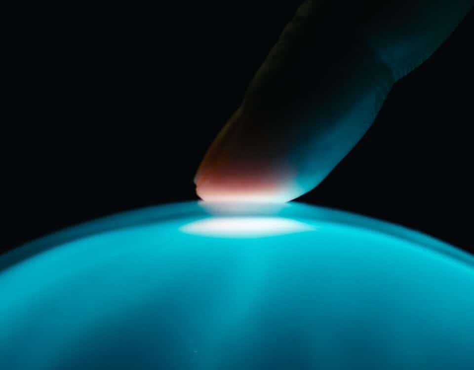 human finger interacts with artificial intelligence