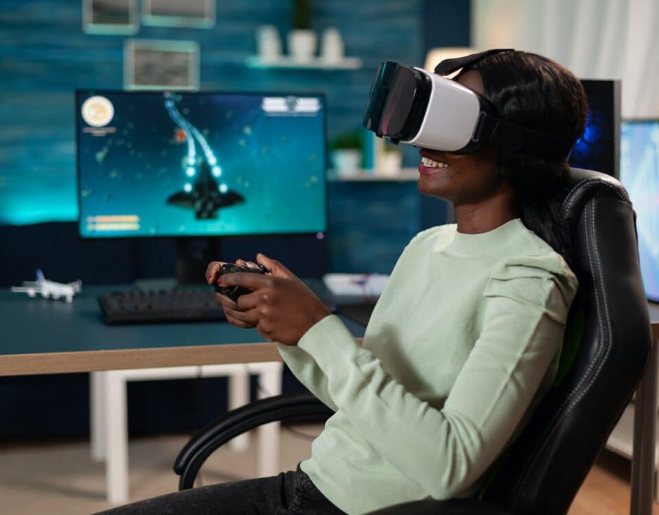 Pro gamer woman wearing virtual reality googles holding gaming controller