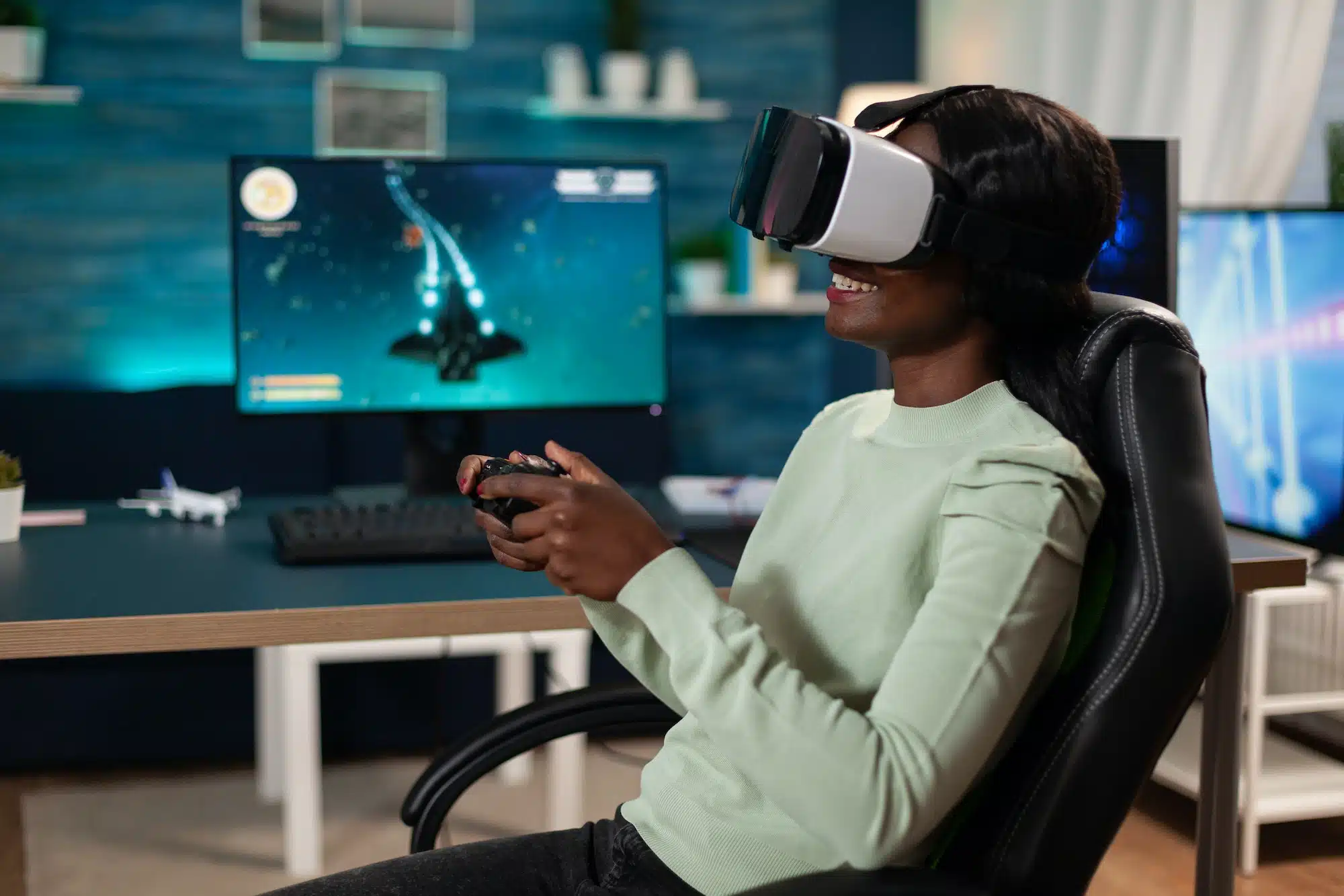 Pro gamer woman wearing virtual reality googles holding gaming controller