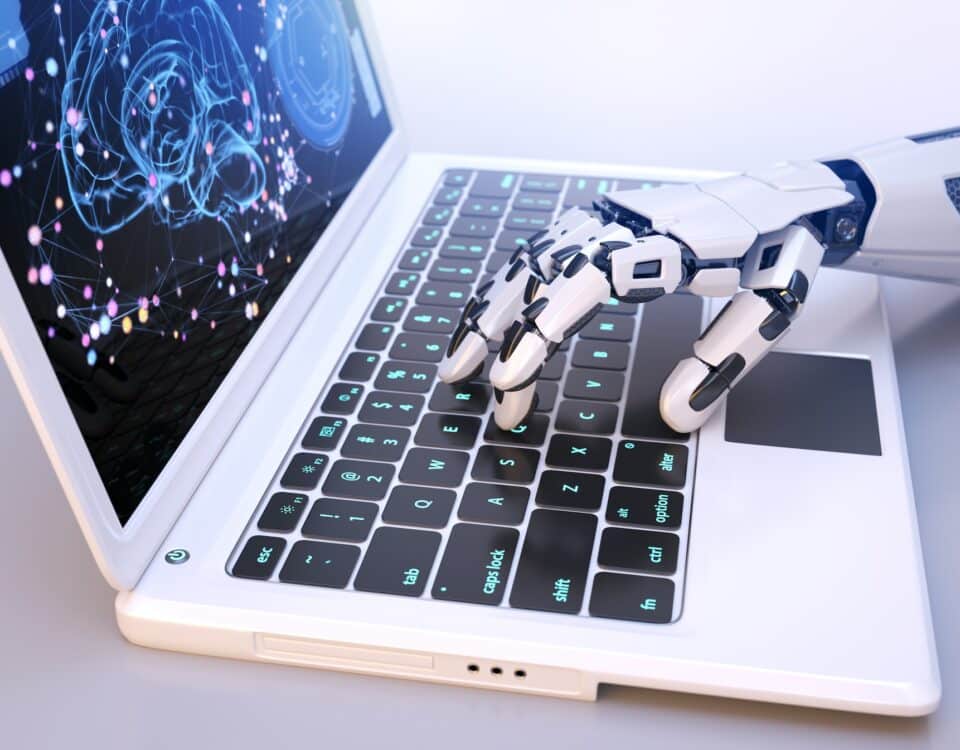 Robot's hand typing on keyboard