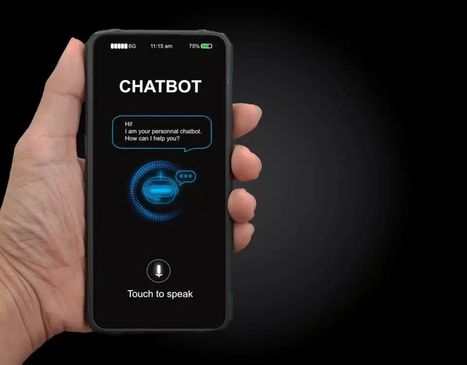 A man's hand holding mobile smartphone with chatterbot application