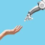 Human hand and robot hand with empty space on blue background