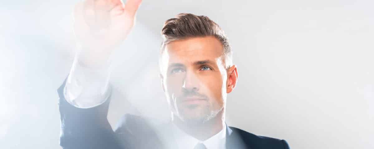 handsome businessman in suit touching something isolated on white, artificial intelligence concept