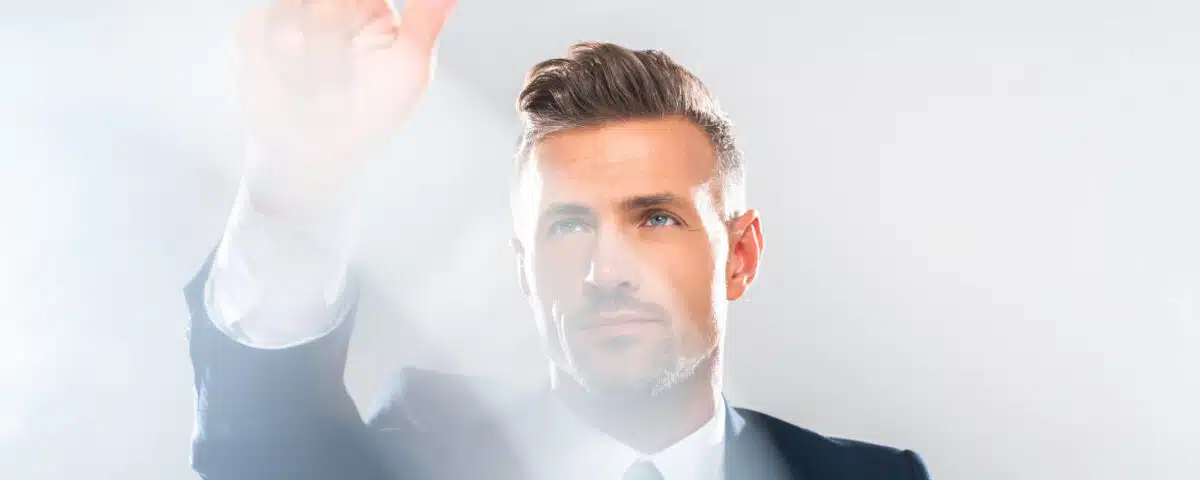 handsome businessman in suit touching something isolated on white, artificial intelligence concept