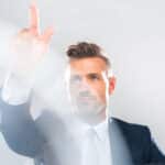 handsome businessman in suit touching something isolated on white, artificial intelligence concept
