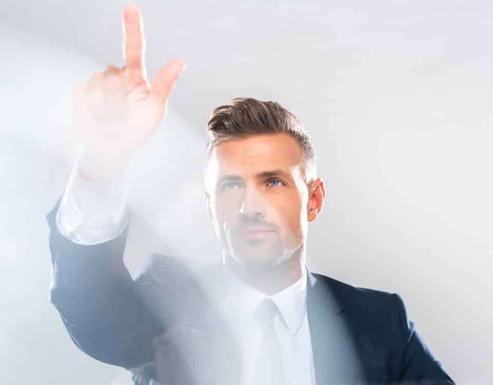 handsome businessman in suit touching something isolated on white, artificial intelligence concept